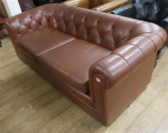 A brown buttoned leather two seater Chesterfield settee, W.190cm